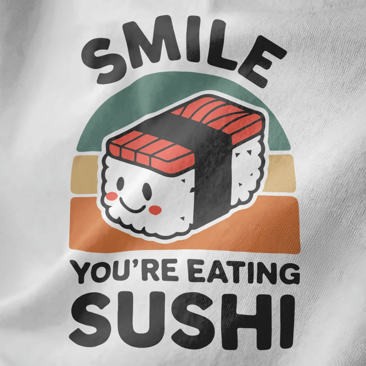 White fabric close-up of smiling nigiri sushi with rosy cheeks, bold "SMILE" text, sushi shirt, kawaii sushi.
