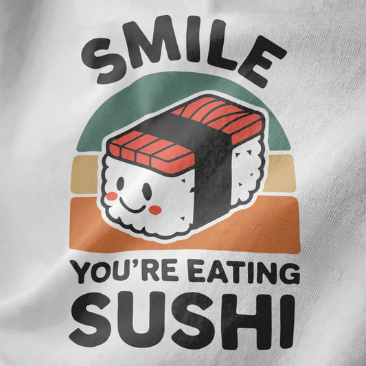White fabric close-up of smiling nigiri sushi with rosy cheeks, bold "SMILE" text, sushi shirt, kawaii sushi.