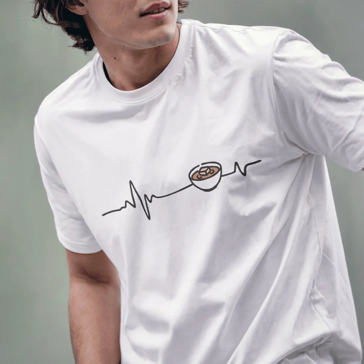 Male model in white miso heartbeat t-shirt, cozy food, minimalist t shirt, positive messaging.