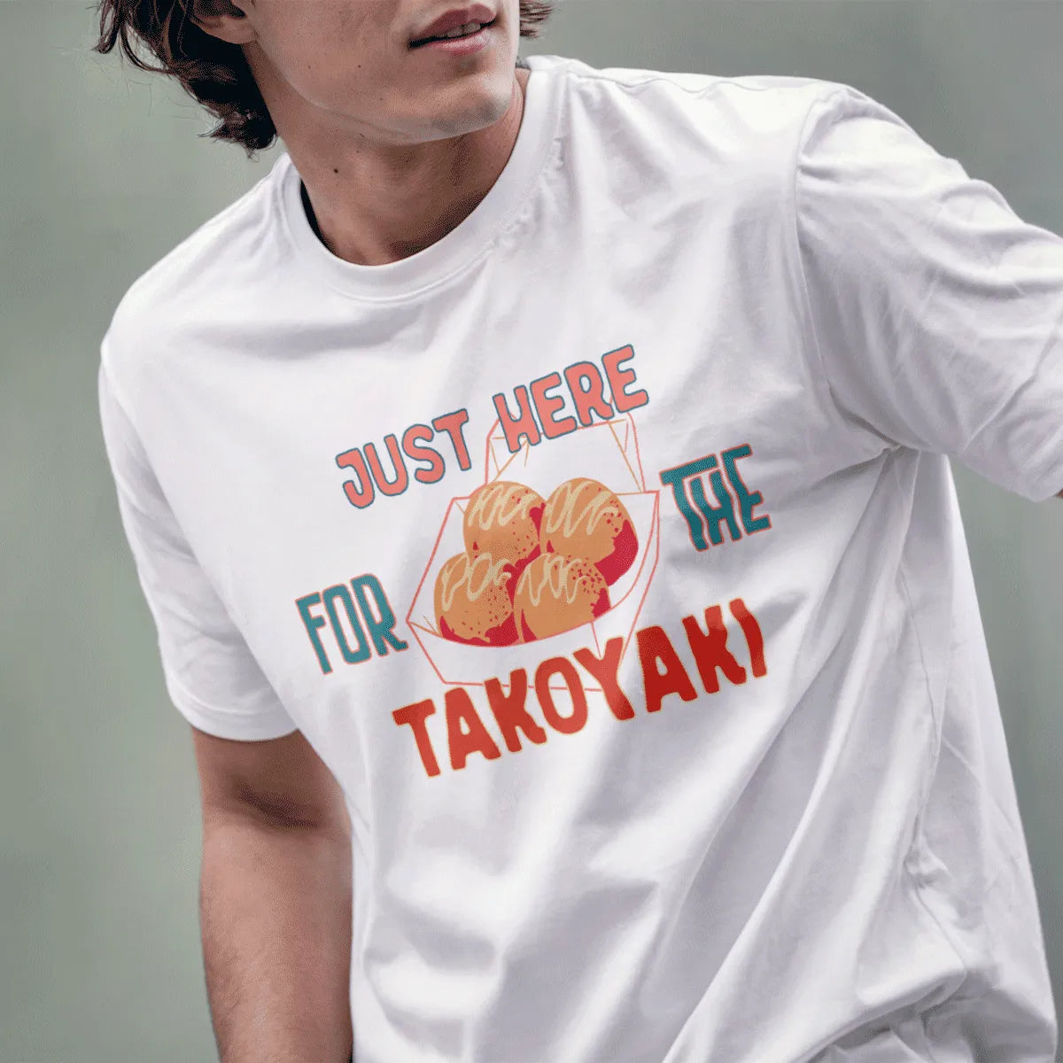 Male model in white takoyaki shirt, bold hand-drawn lettering, foodie style, streetwear t-shirt shirts.