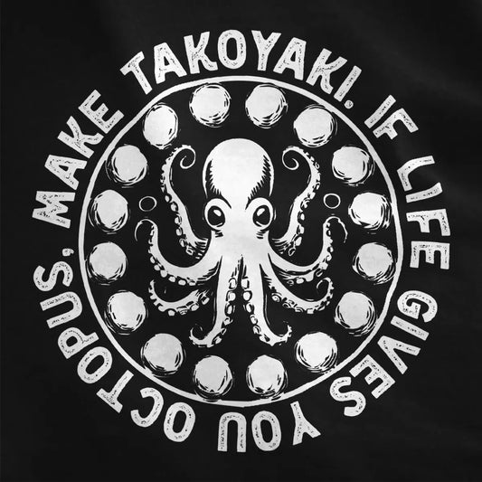 Closeup of black t-shirt with playful octopus art and stylized takoyaki balls, contrast in colors, streetwear shirts.