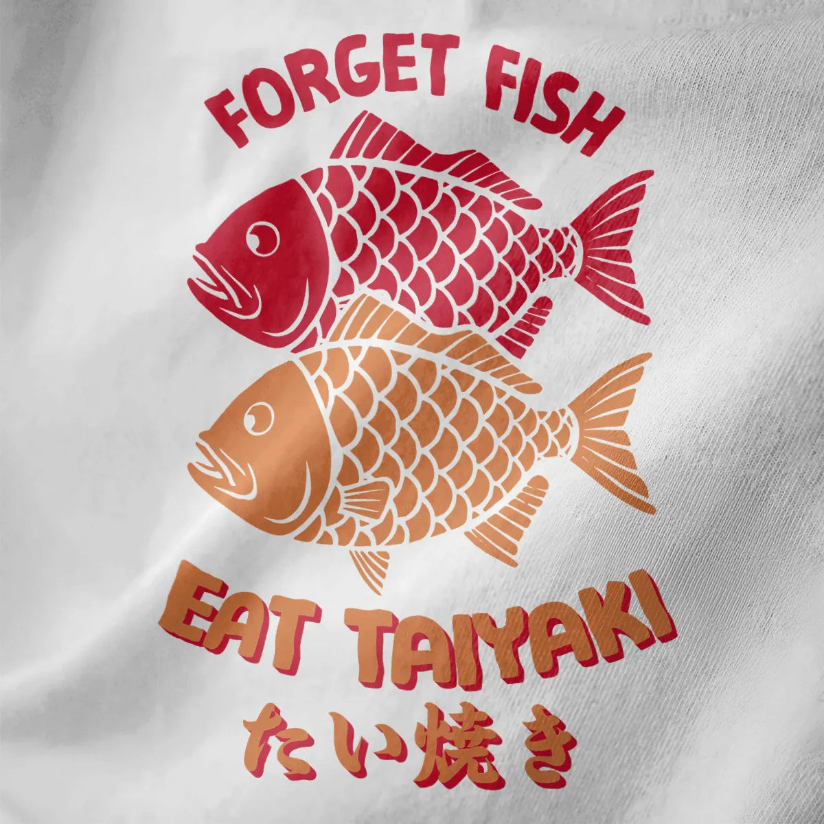 Two stylized taiyaki fish, one red and one beige, with “FORGET FISH EAT TAIYAKI” text on white shirt, retro design.
