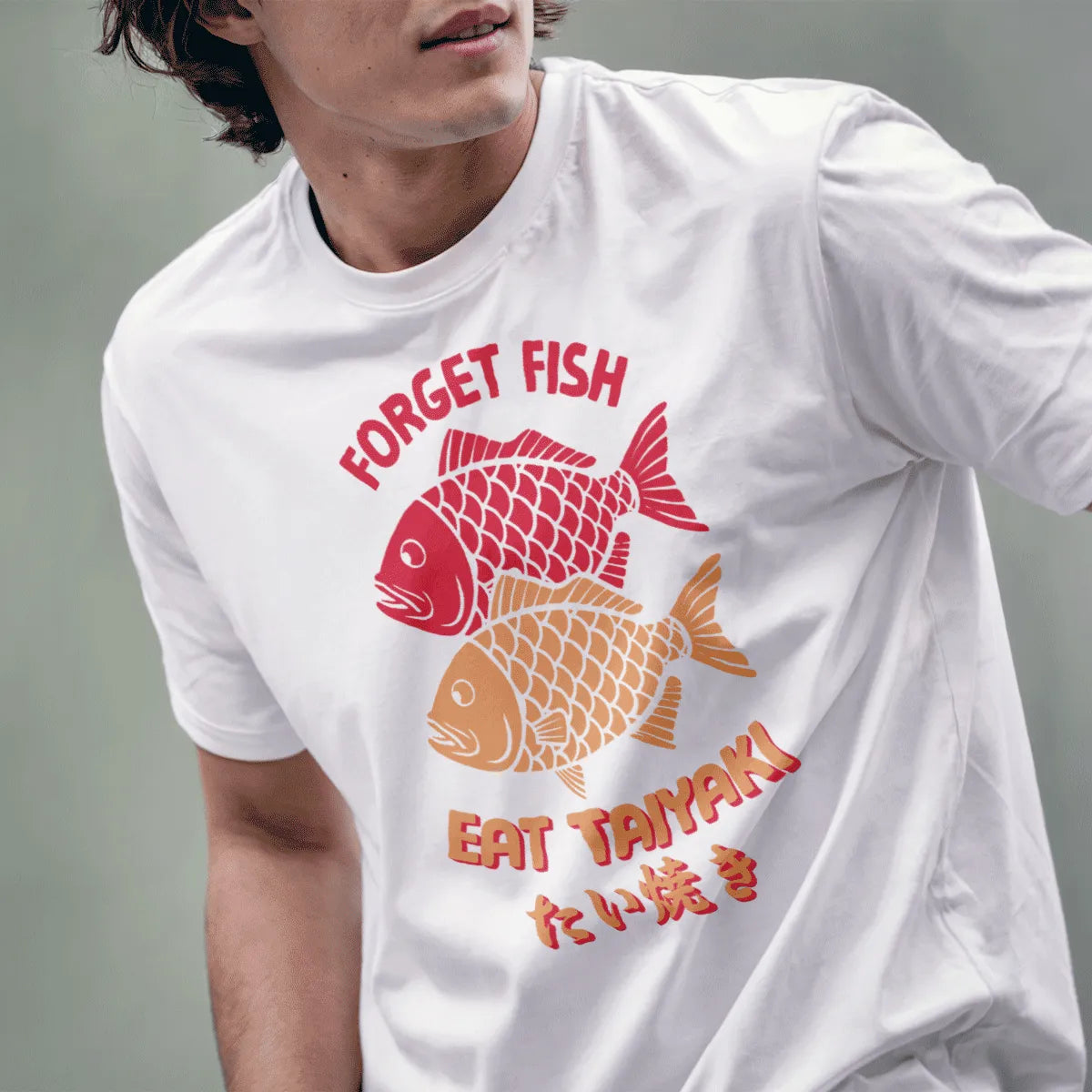 Male model wears white “FORGET FISH EAT TAIYAKI” shirt with two taiyaki fish, bold text fonts, kawaii clothes.