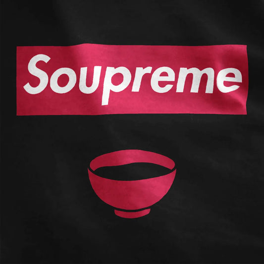Black t-shirt fabric close-up with Soupreme logo parody and red soup bowl, bold typography, streetwear shirt.