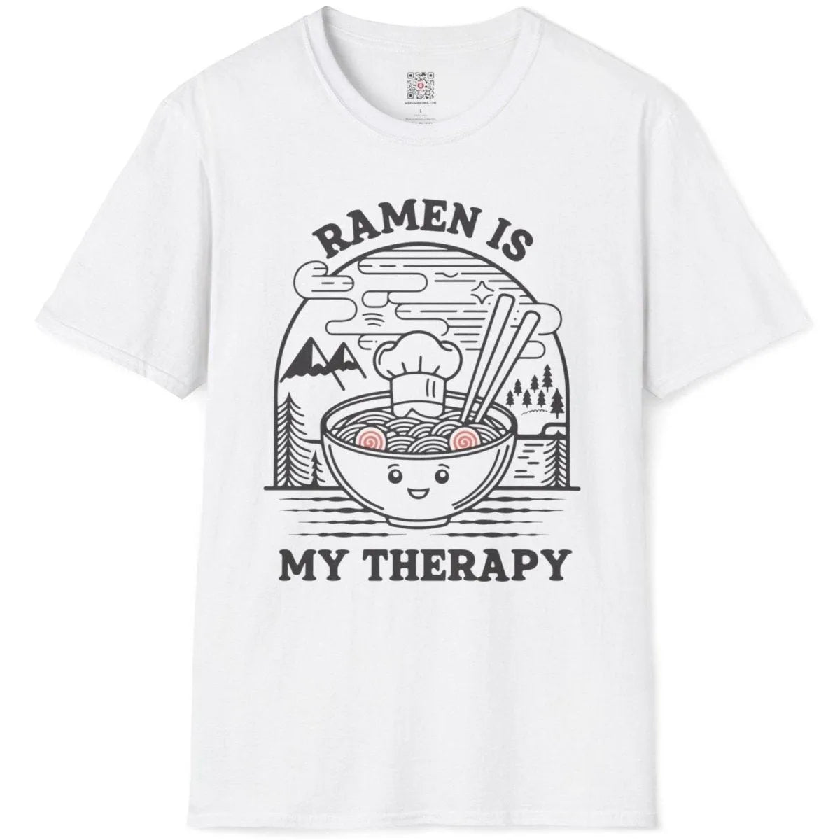 White t-shirt flatlay with anthropomorphic ramen bowl and serene mountain scene, cozy food, positive messaging.
