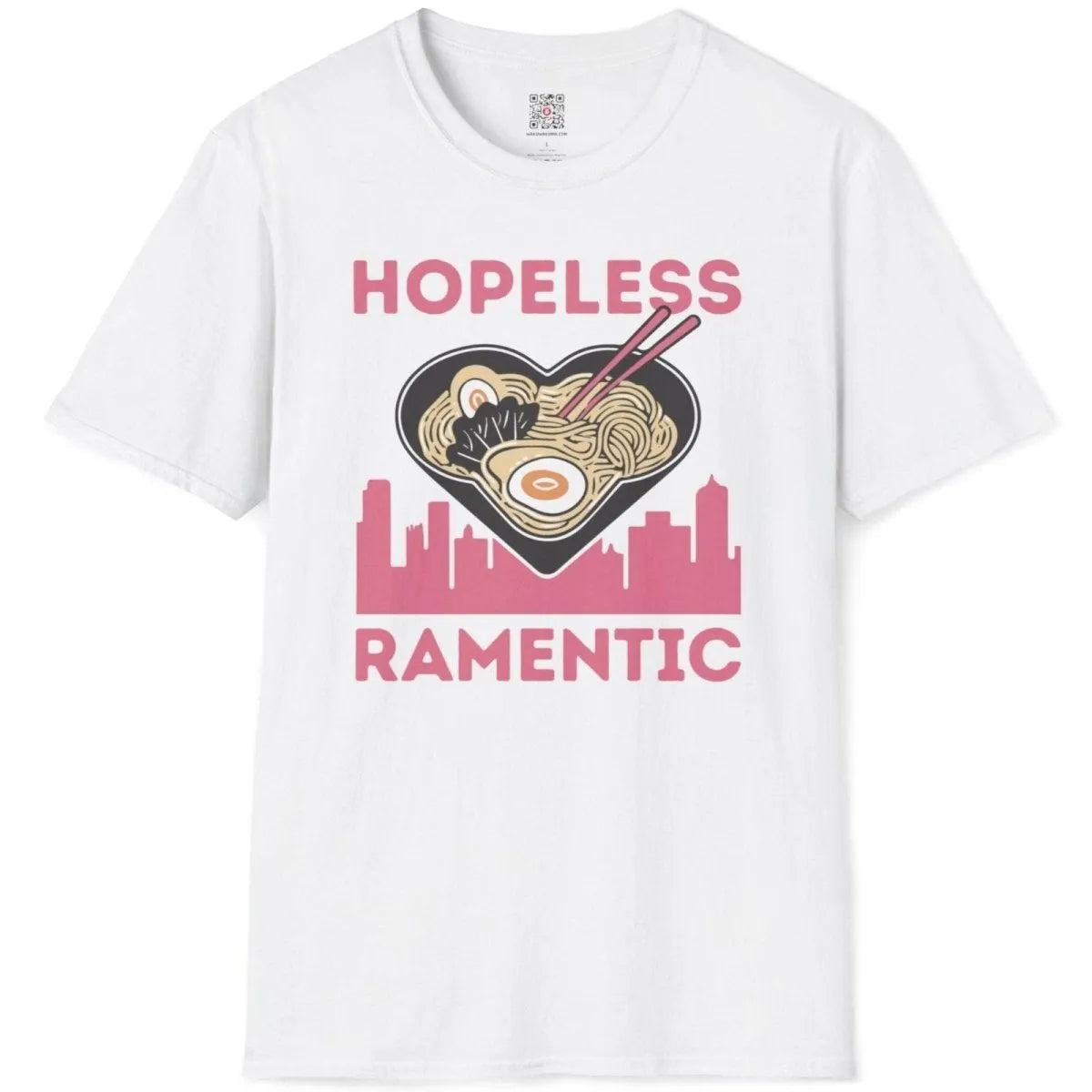 White t-shirt flatlay with whimsical ramen heart bowl, pink cityscape, and humorous quote, ramen shirt.
