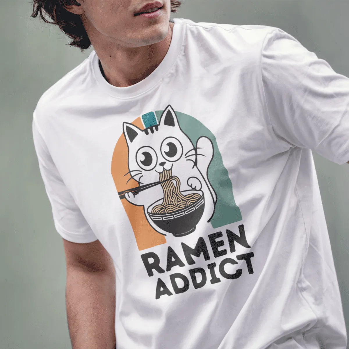 Male model in white t-shirt with adorable ramen cat design, expressive eyes, funny cat shirt, foodie style.