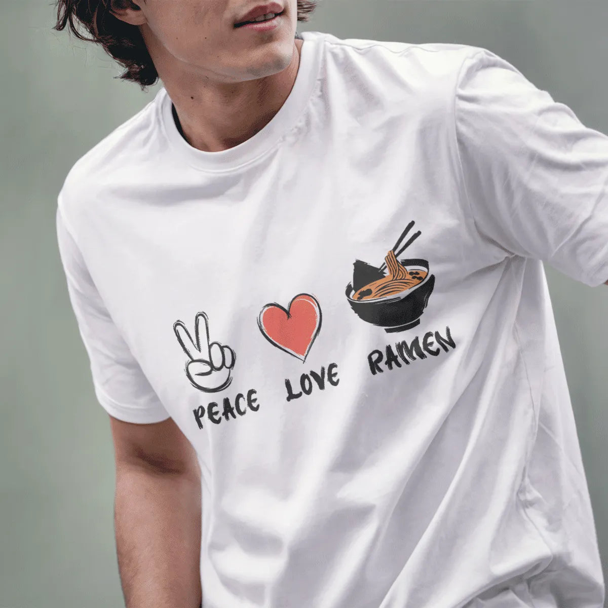 Male model in white t-shirt with peace, heart, and ramen design; ramen t-shirt, positive messaging, urban ramen.