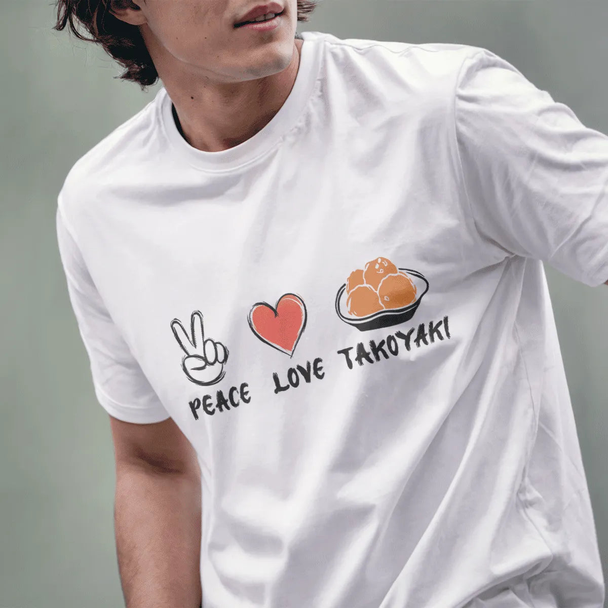 Male model in white t-shirt with peace, heart, and takoyaki icons; japanese t-shirts, culinary delight, rustic charm.