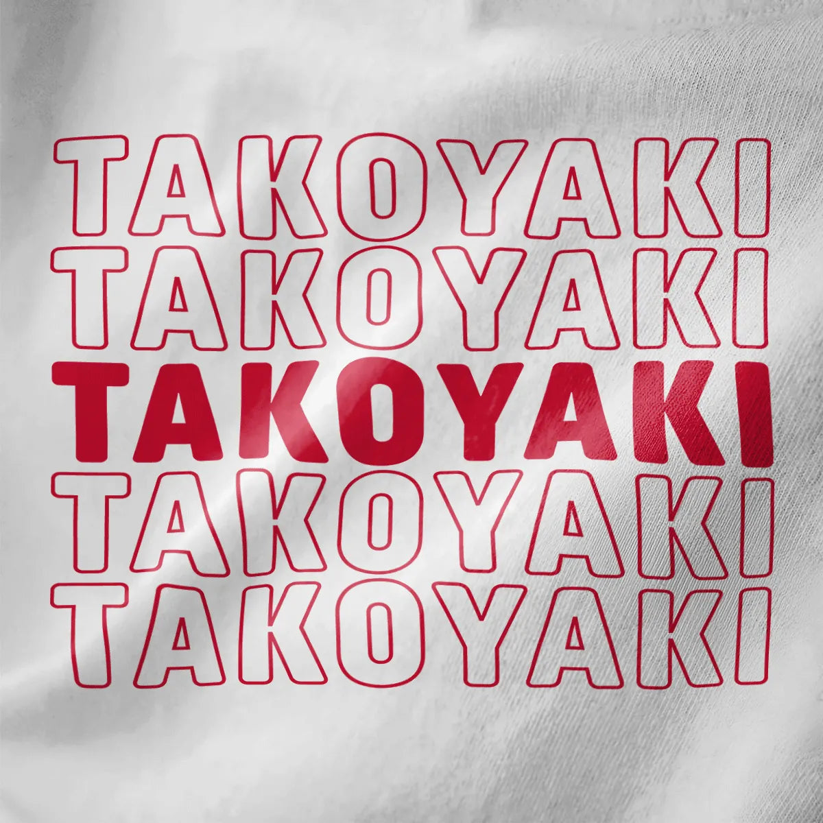 Close-up of white t-shirt showing bold “TAKOYAKI” grid in red, pop-art style, minimalist color scheme.