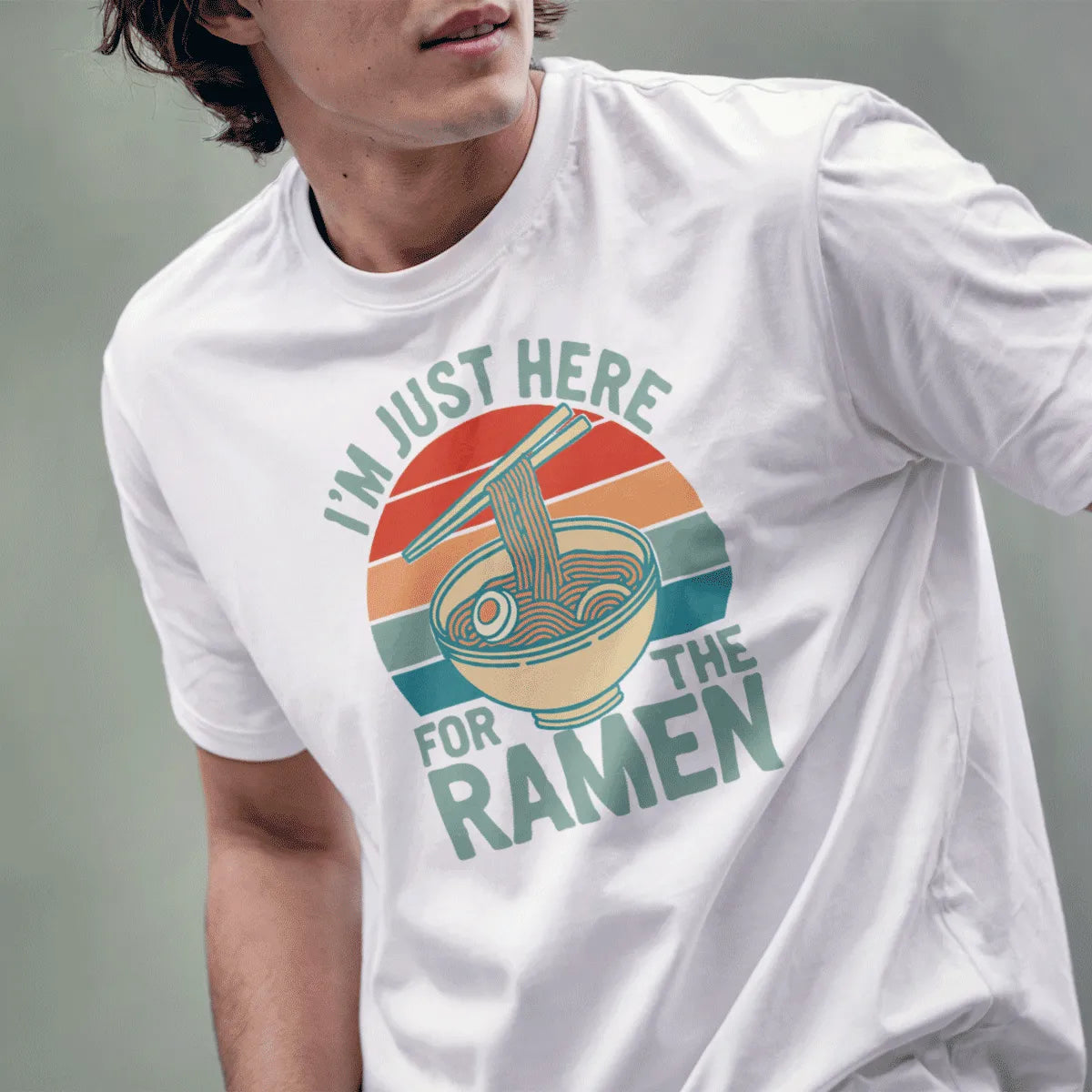 Male in white t-shirt with ramen bowl, chopsticks, and “I’m Just Here For The Ramen” text, ramen t-shirt, retro sunset.