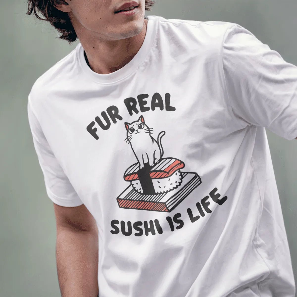 Male model in white shirt featuring whimsical cat on nigiri sushi, rounded “FUR REAL SUSHI IS LIFE” text.