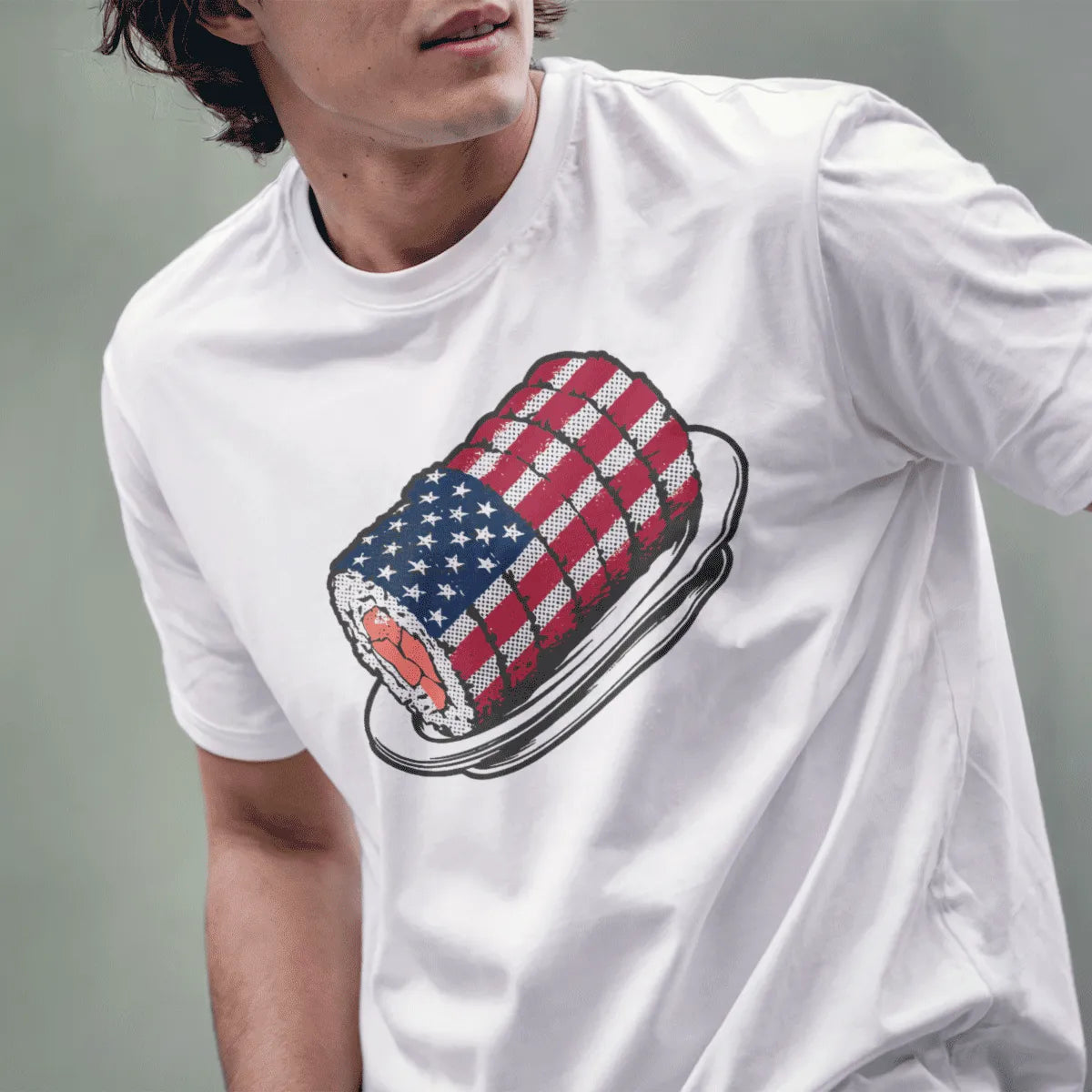 Male model in white t-shirt with sushi roll and flag detail; sushi t-shirt, cultural blend, fusion cuisine.