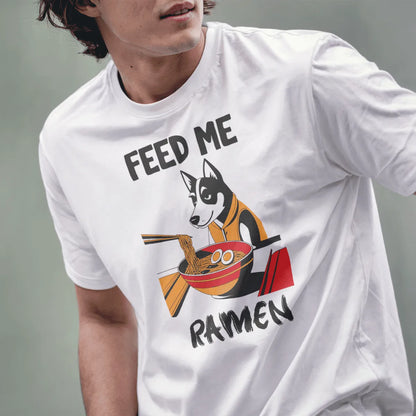 Male model wears white t-shirt with ramen husky, orange hoodie, and “FEED ME RAMEN” text, ramen shirt, cozy food.