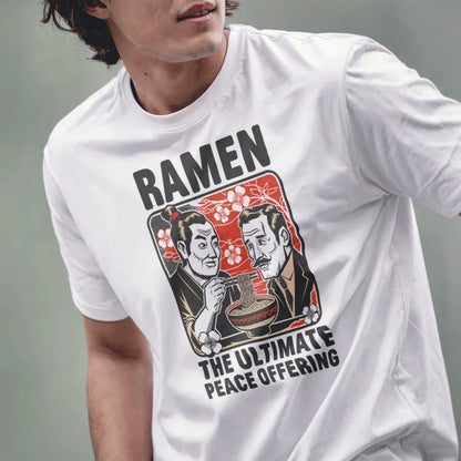 Male model in white t-shirt with ramen peace design, cherry blossoms, and friendship theme.