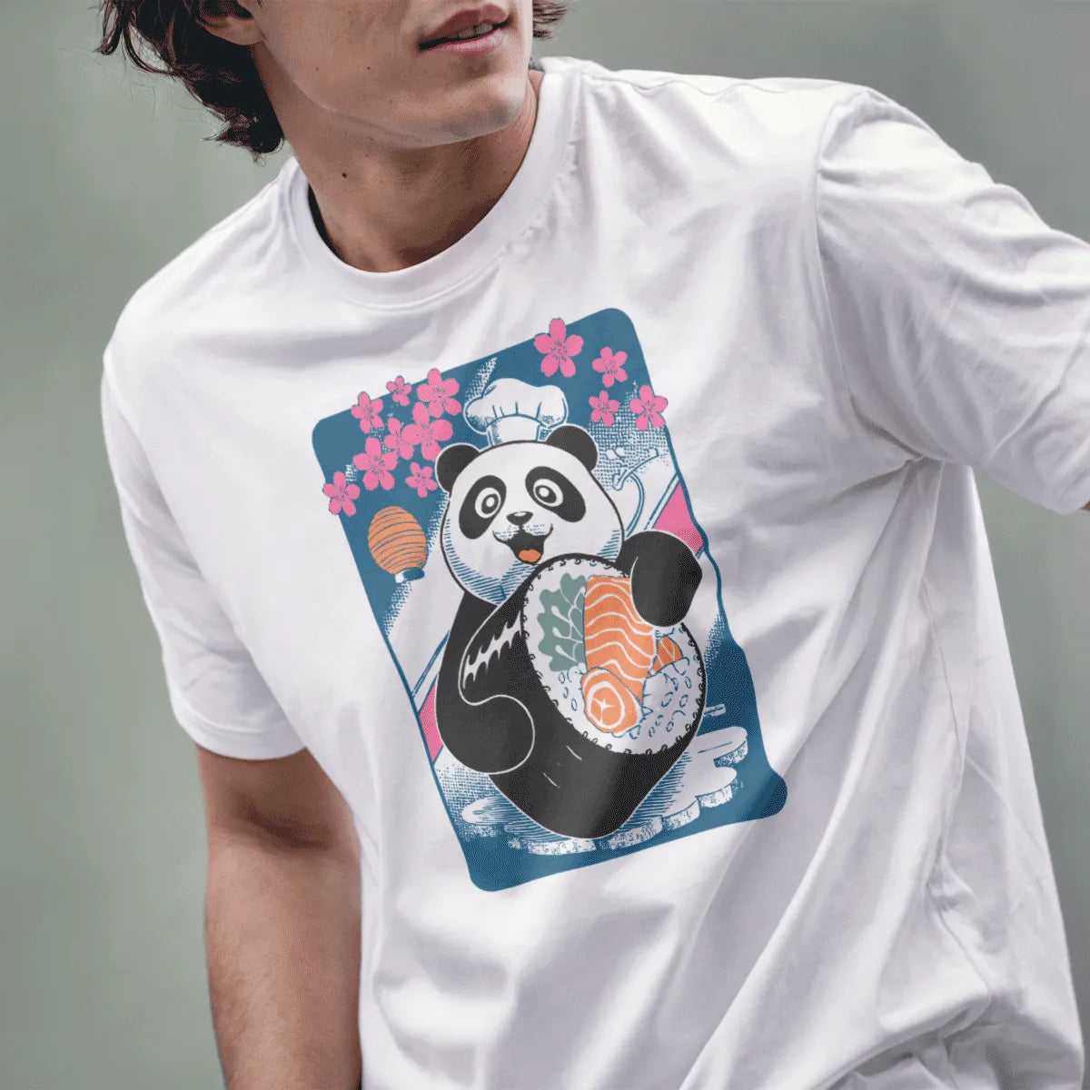 Male model wearing white panda sushi chef t-shirt, cherry blossoms and Japanese lantern in background.