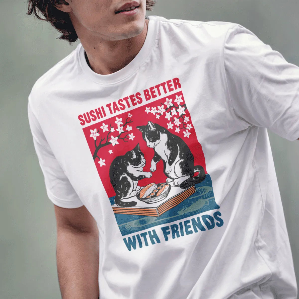 Male model in white t-shirt with sushi cats and cherry blossoms, sushi shirt, friends themed shirts.