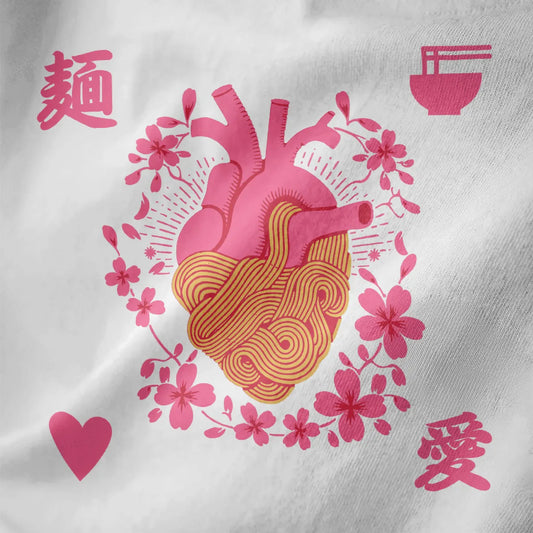 White fabric close-up of a pink heart entwined with yellow ramen noodles and cherry blossoms, ramen t-shirt.