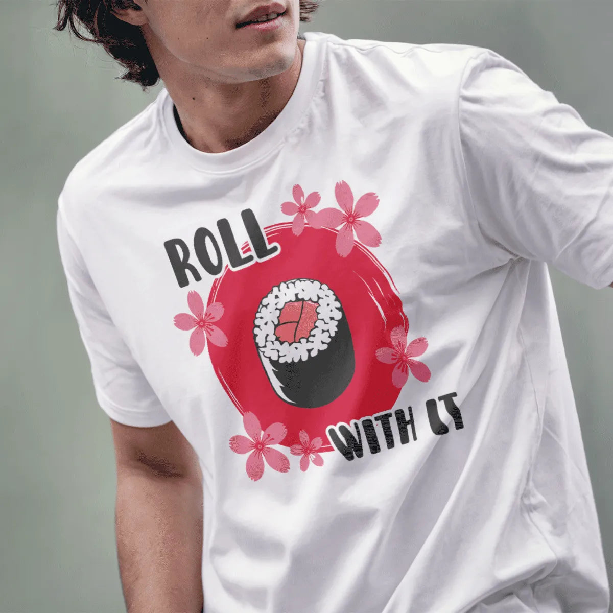 Male model in white t-shirt with sushi roll, red background, and "ROLL WITH IT" text, sushi shirt.