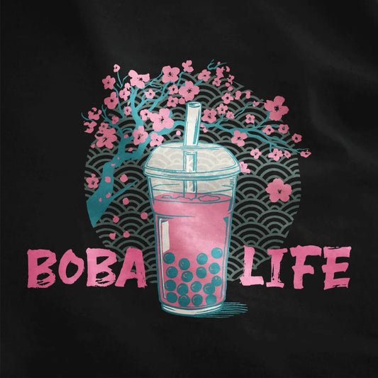 Closeup of boba tea cup with cherry blossom art and wave background on black shirt, japanese t-shirts, cultural symbols.