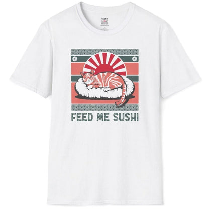 White flatlay tee featuring orange tabby on sushi, red sun, green waves, and “FEED ME SUSHI” text, sushi t-shirt.