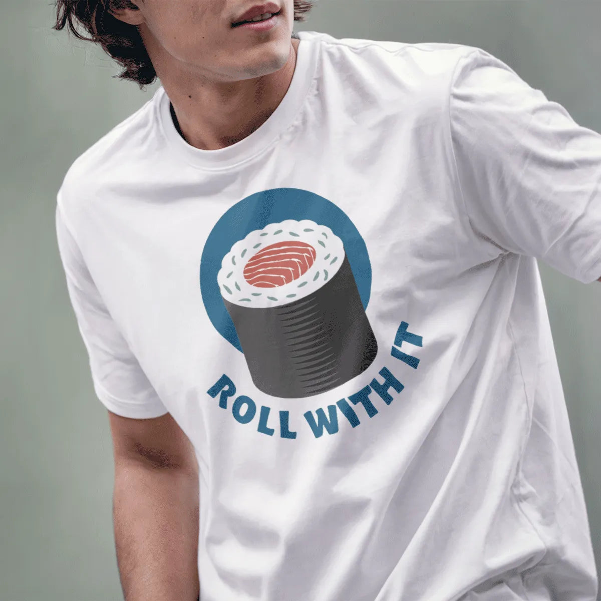 Male model in white sushi t-shirt with playful sushi roll and "ROLL WITH IT", japanese t-shirts, graphic t-shirts stores.