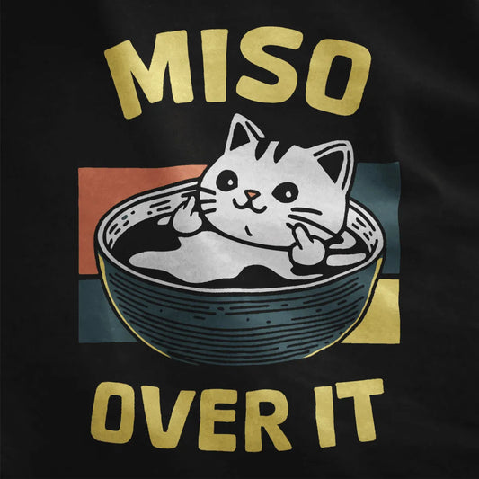 Black shirt closeup, cat in miso soup bowl, middle fingers, bold retro blocks, shirt with cat middle finger.