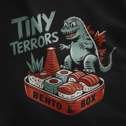 Black fabric closeup of whimsical Godzilla on sushi bento, godzilla shirt, traditional Japanese art.
