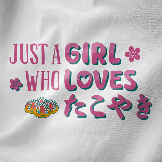 White fabric close-up of three smiling takoyaki balls, pink cherry blossoms, and playful slogan, kawaii clothes.