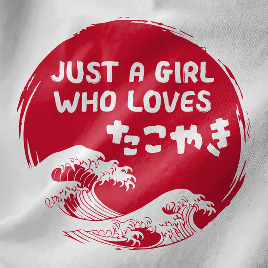 White fabric closeup showing bold red sun, kanji for takoyaki, and flowing ukiyo-e waves. japanese t shirts, foodie style.