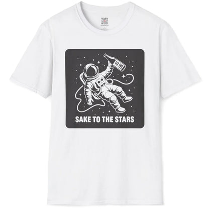 White t-shirt flatlay, astronaut with sake bottle, "SAKE TO THE STARS" text, japanese t-shirts, cosmic design.