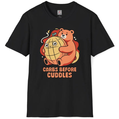 Black t-shirt flatlay, orange bear with melon pan, "CARBS BEFORE CUDDLES" text, junk food shirt, foodie style.