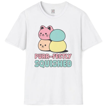 White t-shirt flatlay, pink and beige mochi cats, "PURR-FECTLY SQUISHED" text, funny cat shirt, japanese t-shirts.