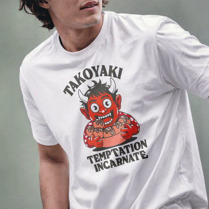 Male model wearing white t-shirt with cartoonish red oni holding Japanese snack popular takoyaki.