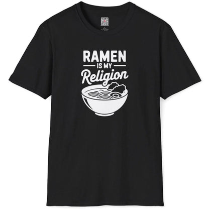 Black t-shirt flatlay with RAMEN IS MY Religion bold text and stylized ramen bowl, art t shirts, cultural pride.