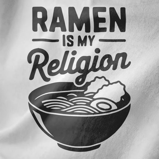 Bold RAMEN IS MY Religion design in black ink on white fabric, featuring minimalist bowl graphic and modern fonts.