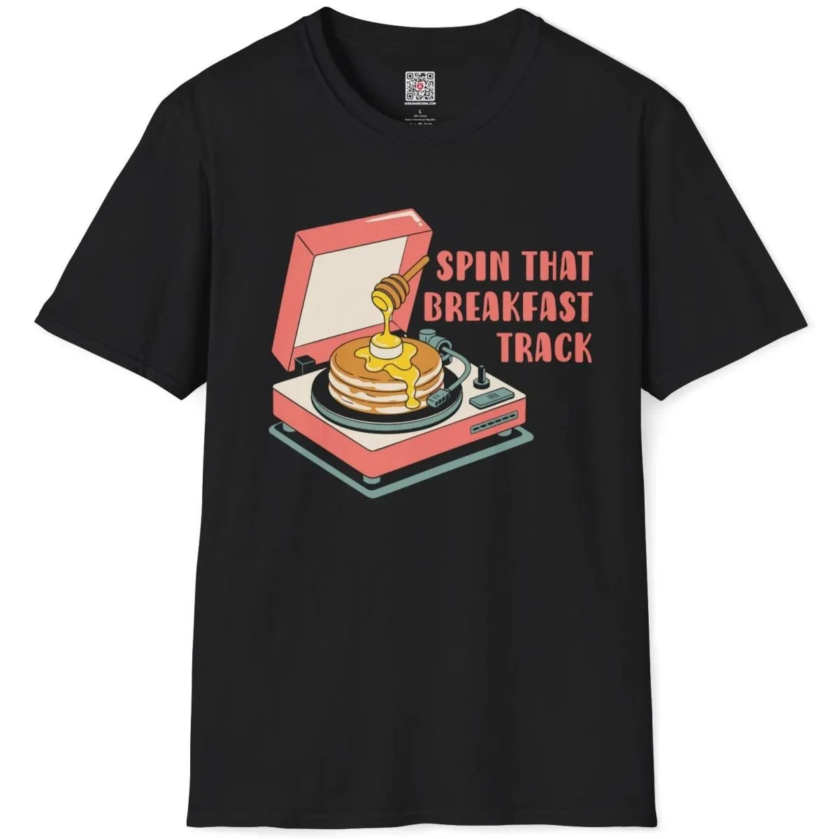 Black flatlay t-shirt featuring vintage record player, pancakes, and bold "SPIN THAT BREAKFAST TRACK". retro comic