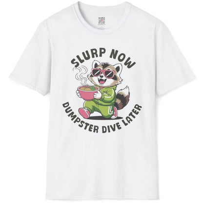 White t-shirt flatlay with raccoon eating ramen, pink sunglasses, cartoonish style, positive messaging.