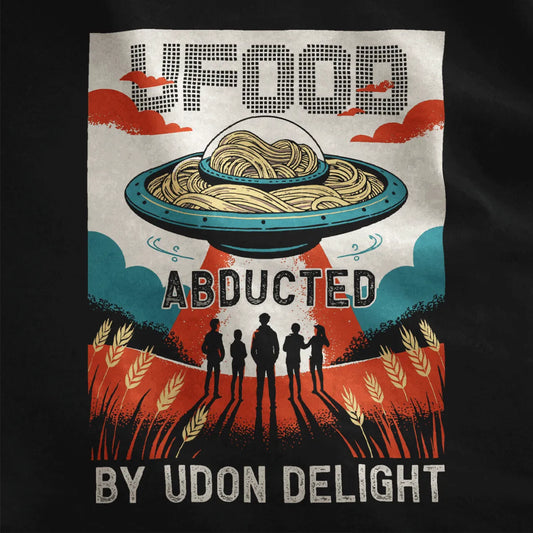 Close-up of black t-shirt fabric with sci-fi UFO design, golden udon noodles, and playful comic style details.
