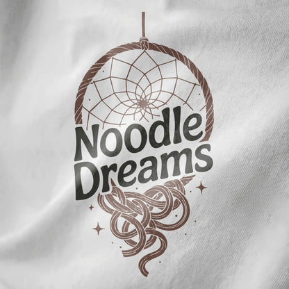 Close-up of white fabric featuring circular dreamcatcher with flowing ramen noodles and sparkling stars.