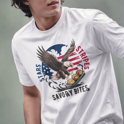 Male model wears white t-shirt featuring powerful eagle, savory bites tray, and stars and stripes background.