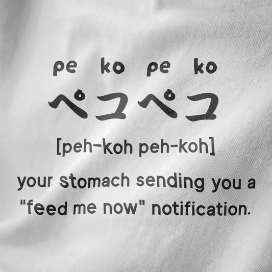 Minimalist "peko-peko" hunger phrase and katakana on white shirt fabric, foodie style, japanese t shirts.