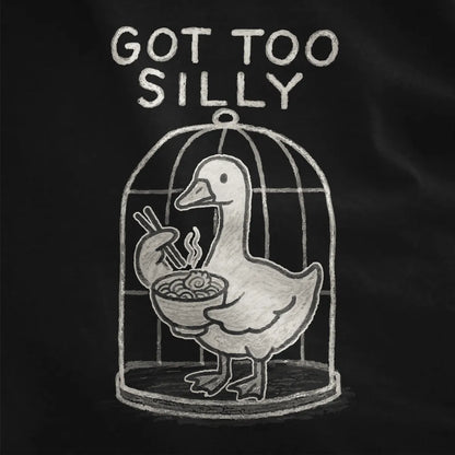 Sketch-style duck inside rounded birdcage with ramen and playful quote, black shirt up-close detail.