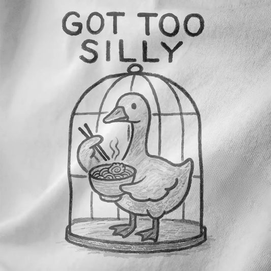 Whimsical hand-drawn duck with chopsticks and ramen bowl, "GOT TOO SILLY" text, white shirt fabric texture.