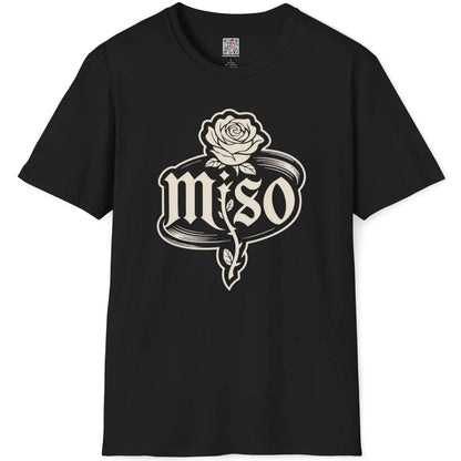 Black t-shirt flatlay displays bold monogram rose in full bloom, oval frame and vintage miso text, statement shirt.