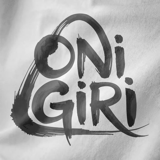 Close-up of bold brushstroke "Onigiri" text on white fabric with dynamic, handwritten style.