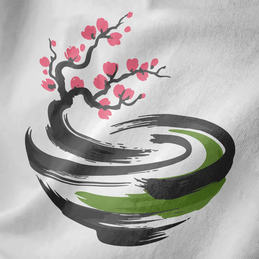 Close-up of delicate pink cherry blossom branch over abstract bowl in soft brushstrokes on white fabric.