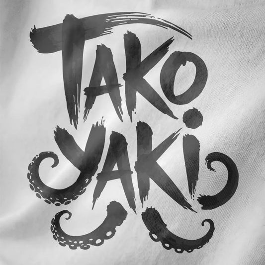 Close-up of bold, brushstroke "TAKO YAKI" text with playful octopus tentacles on white fabric.