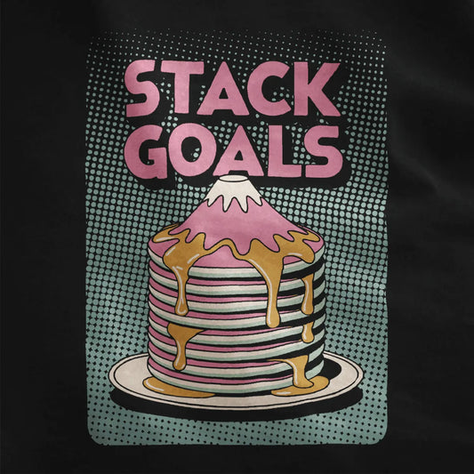 Black fabric close-up showing Mount Fuji-inspired pastel pink pancake mountain with dripping syrup and block text.