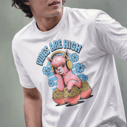 Male model wears white tee with whimsical pink alpaca, yellow headphones, and ramen art, lower face visible.